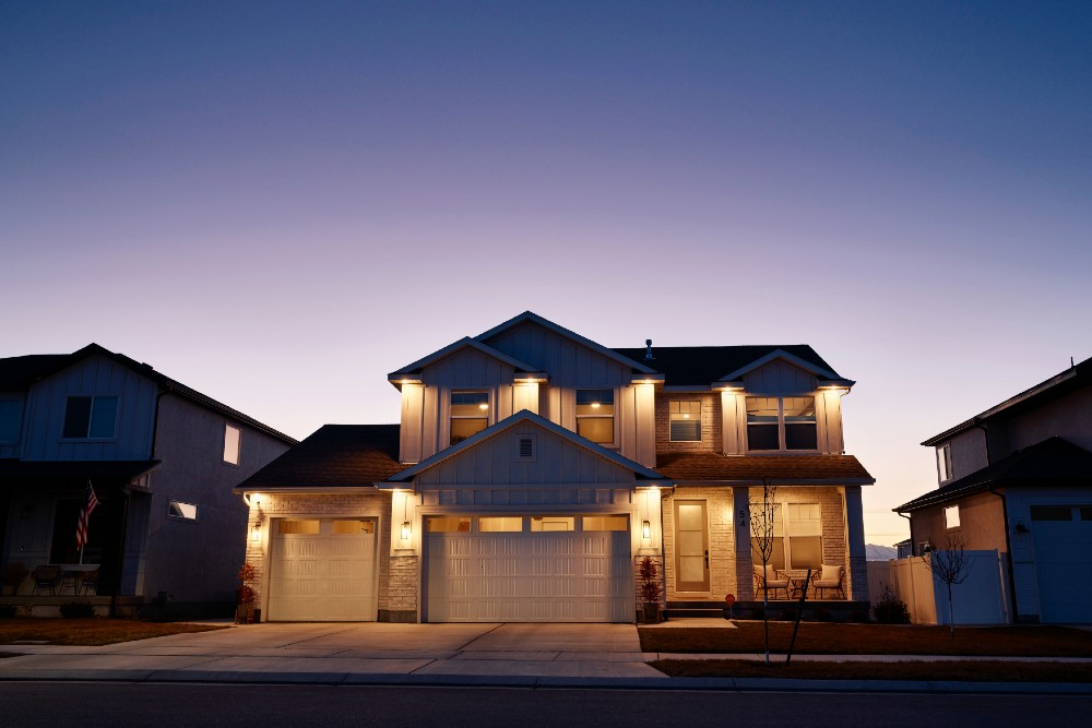 house at dusk with lights on