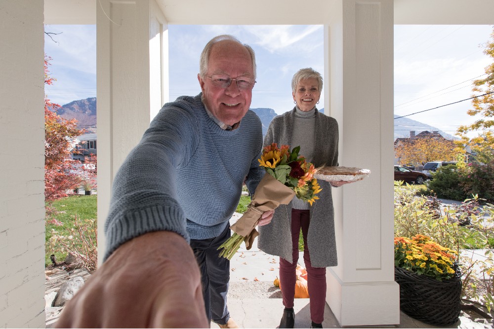 Grandparents visiting for Thanksgiving ringing the Vivint Doorbell Camera Pro