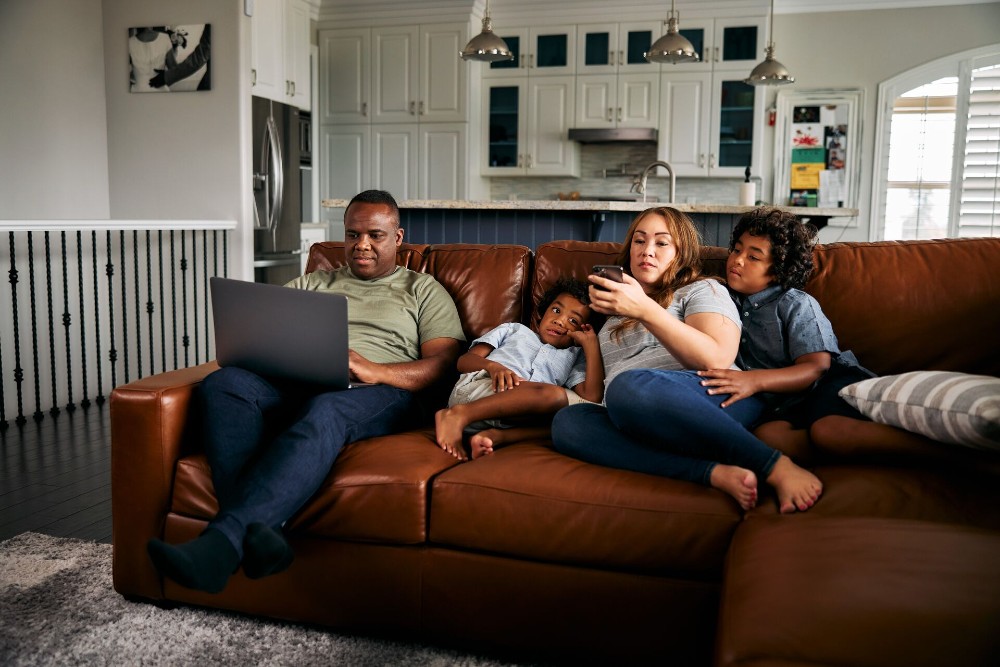 Family sitting on the couch.